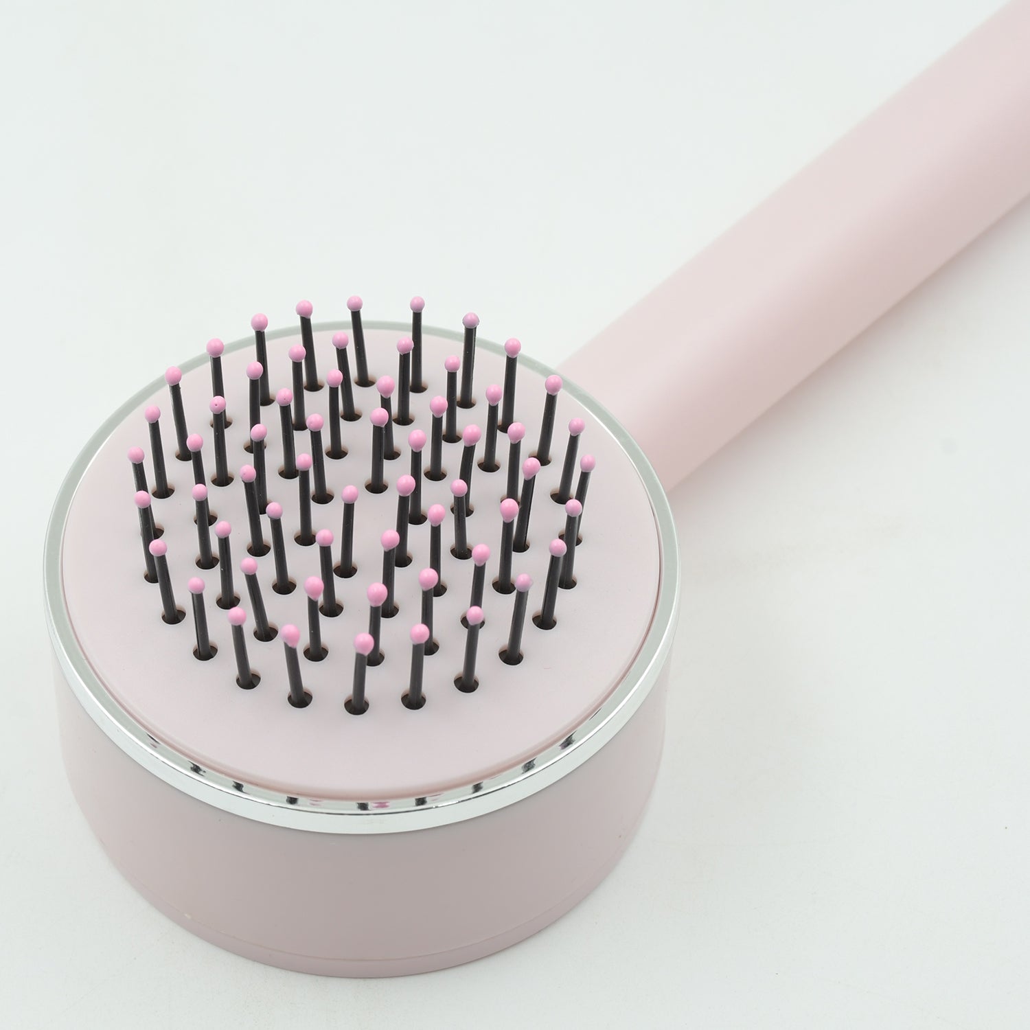 Self-cleaning detangling brush Self-cleaning detangling brush
